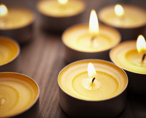 Candles lit to honor a loved one