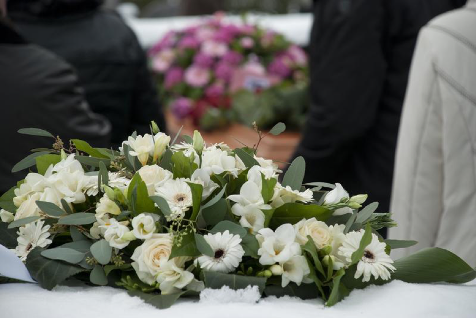 A flower arrangement on a casket.